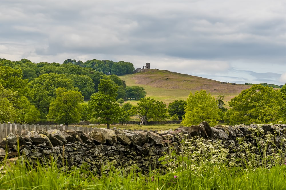 A view towards Bradgate Park from the shore of Cropston Reservoir in Leicestershire in summertime