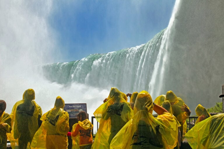Tourists at the Horseshoe Fall, Niagara Falls, Ontario, Canada - pros and cons of living in Canada