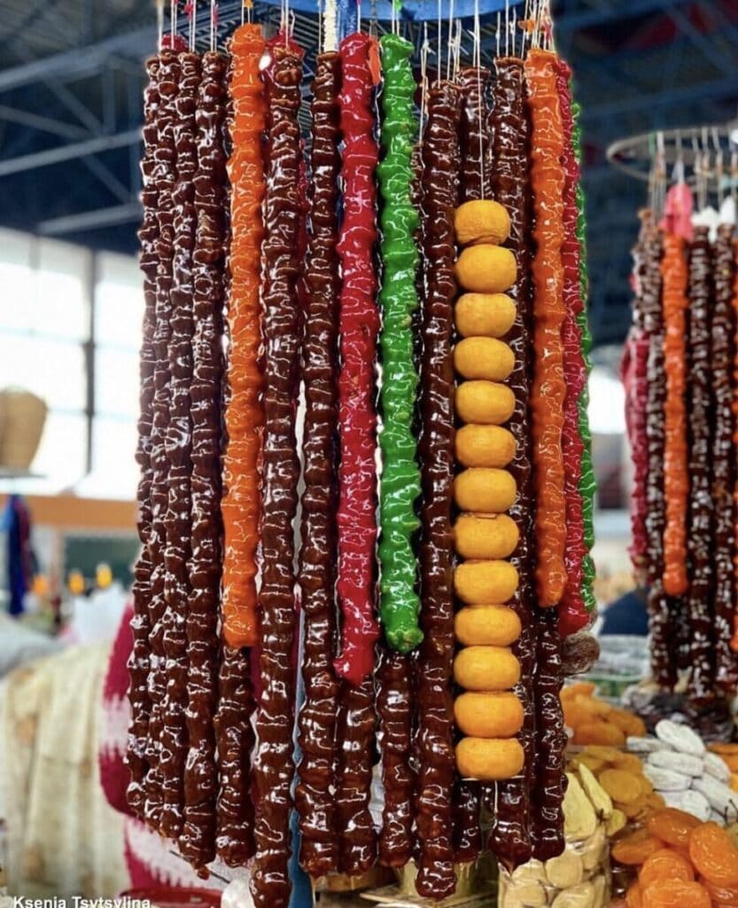 A variety of dried fruits hanging on a string, commonly found in Armenian food.