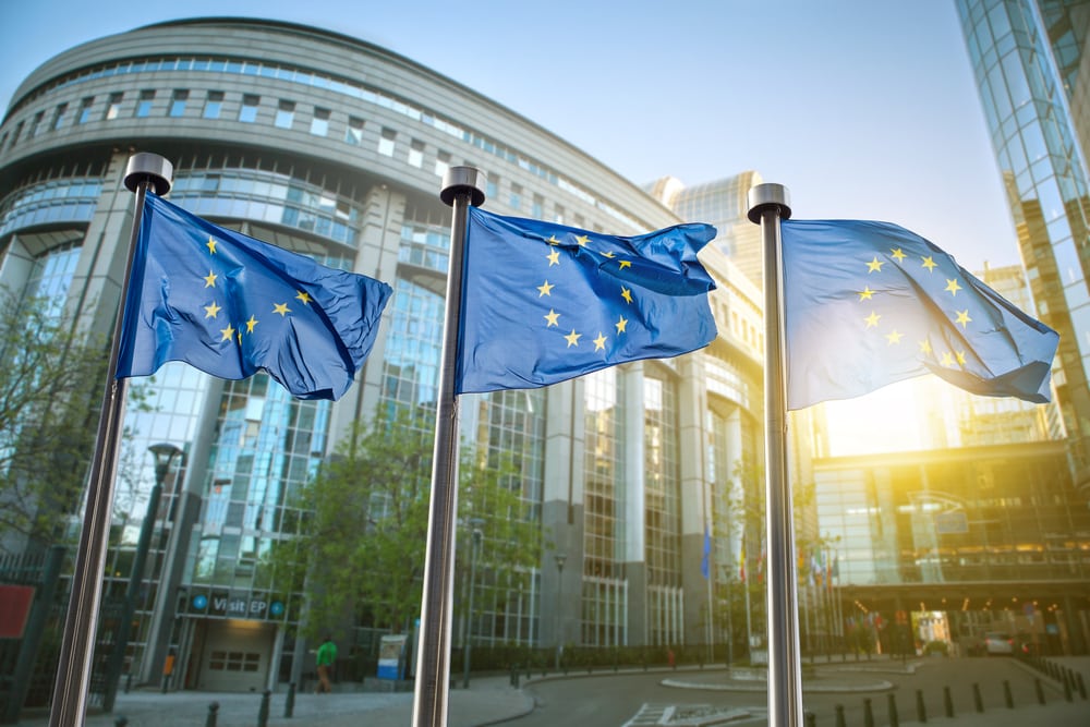 European union flag against parliament in Brussels, Belgium