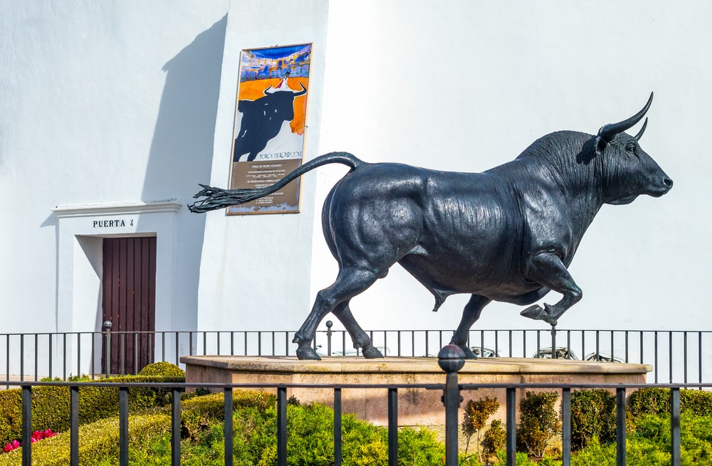 Ronda,  Spain - December 11, 2014: A bull monument in front of Plaza de Toros (Bullring)