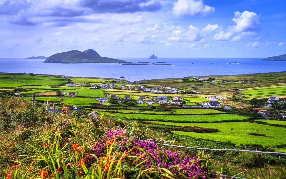 Dunquin village on the edge of Atlantic Ocean with surrounding fields, farms and small islands, Dingle Peninsula, Wild Atlantic Way, Kerry, Ireland