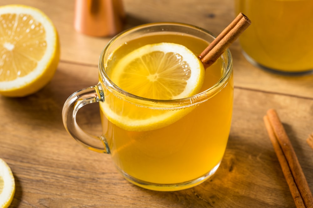 Scottish food Boozy Warm Holiday Hot Toddy Cocktail with whiskey and Lemon