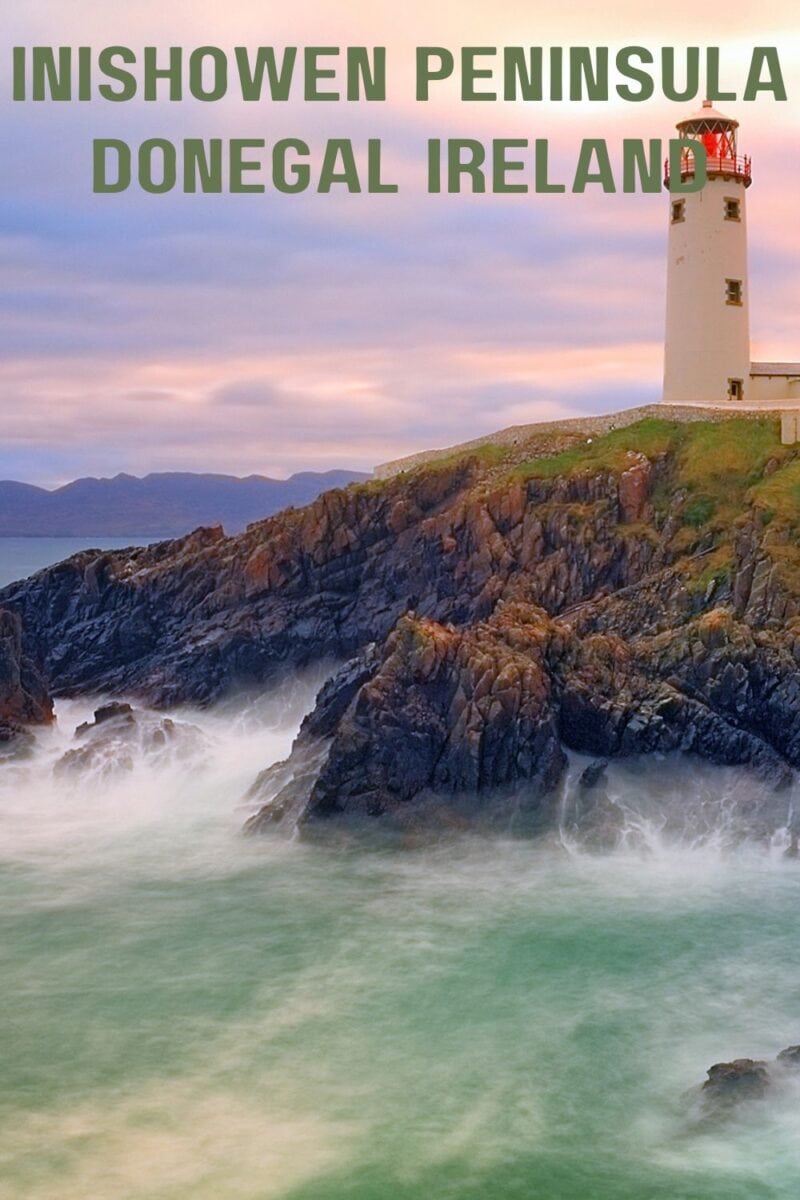 Lighthouse on rocky coastline, one of the things to do in Inishowen Peninsula, Donegal, Ireland.