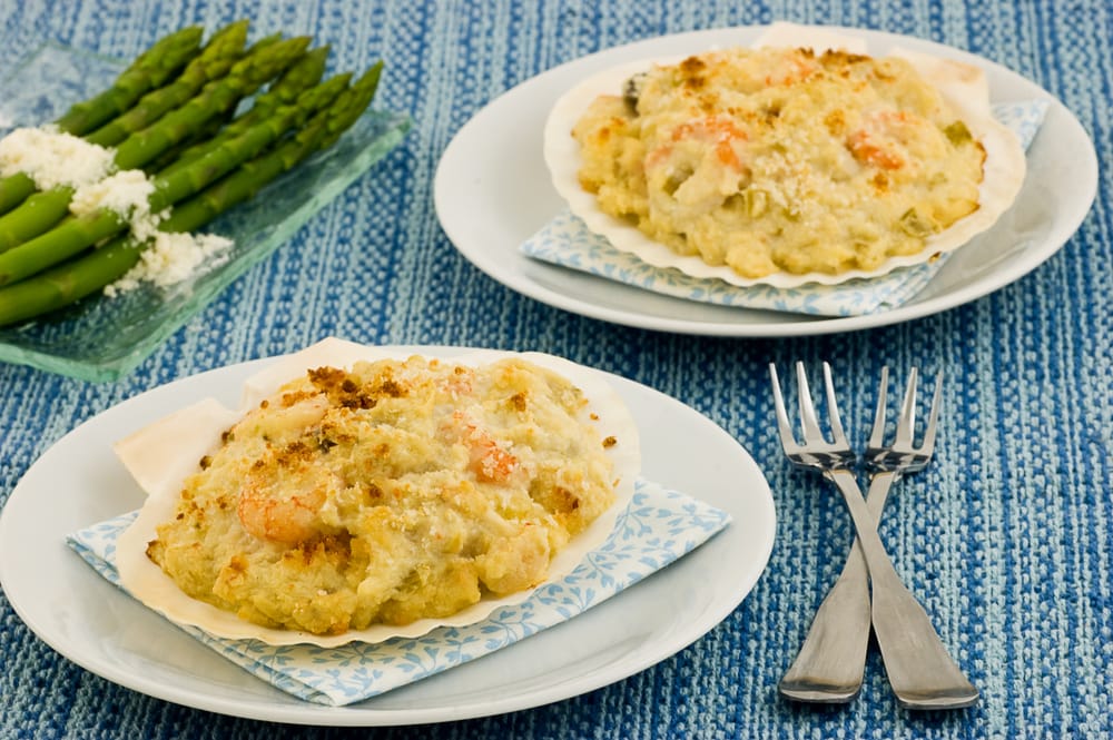Coquille St. Jacques seafood in scallop shells with asparagus