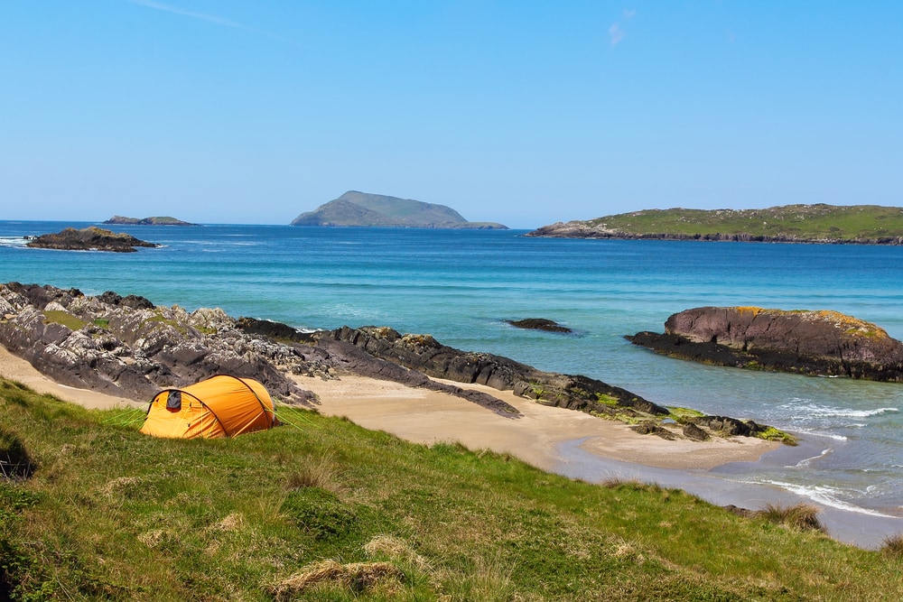 Camping tent placed on the coast of Derrynane bay , famous Ring of Kerry , Ireland