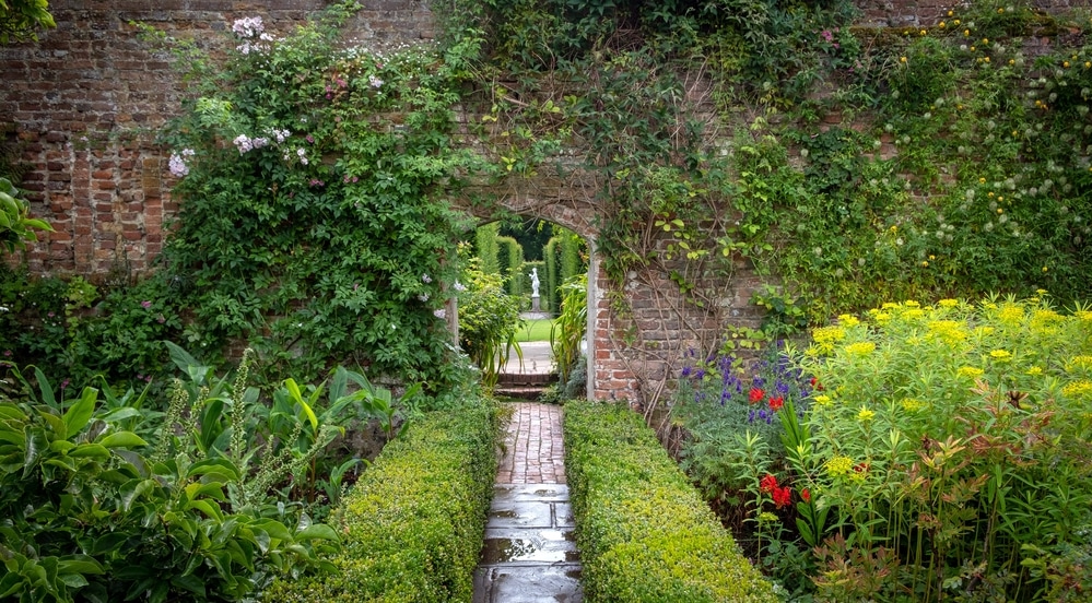 Beautiful flowers, trees and plants and garden landscaping in Sissinghurst Castle Gardens in Cranwood, England