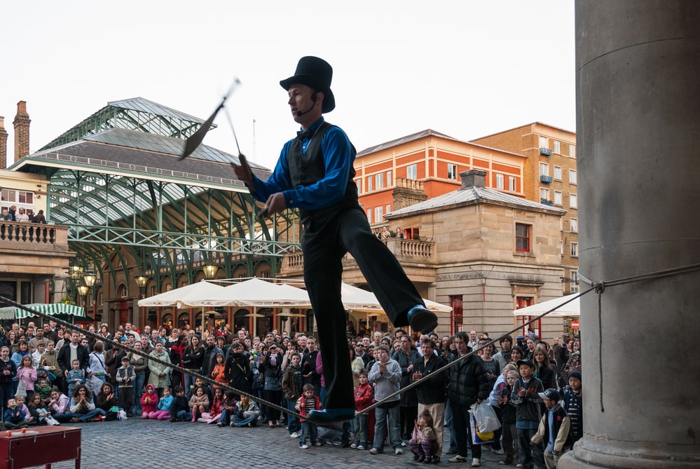 An unidentified juggler performs in Covent Garden, London. Covent Garden, one of the main attractions in London, is known for everyday street performance through the whole year.