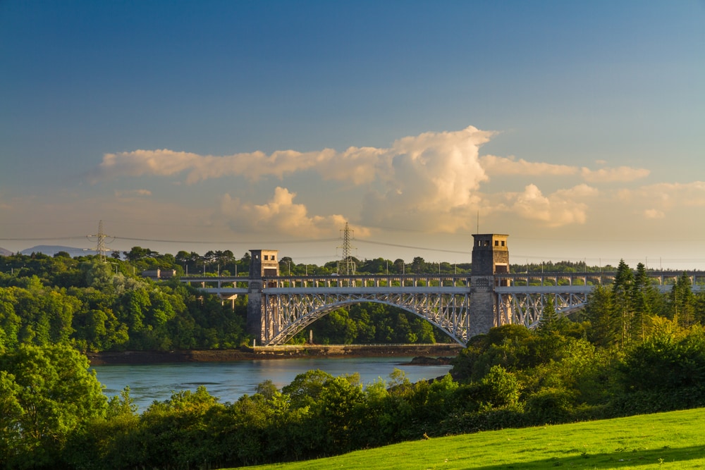 Robert Stephenson Britannia Bridge carries road and railway across the Menai Straits between, Snowdonia and Anglesey. Wales, United Kingdom