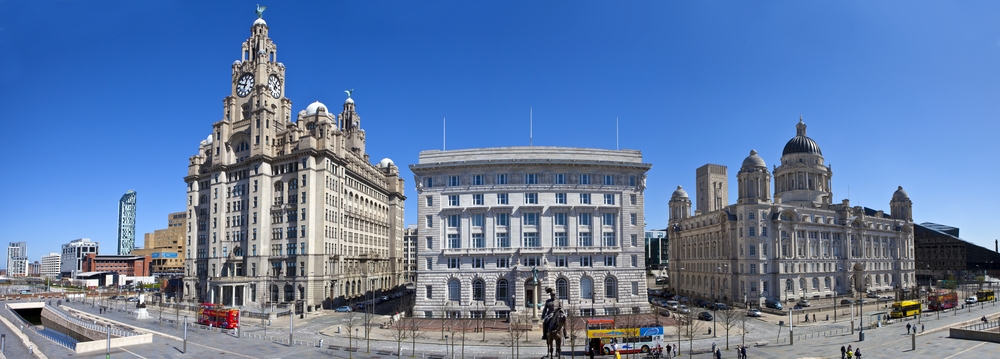A panoramic view of the Three Graces in Liverpool: The Royal Liver Building, Cunard Building and the Port of Liverpool Building.