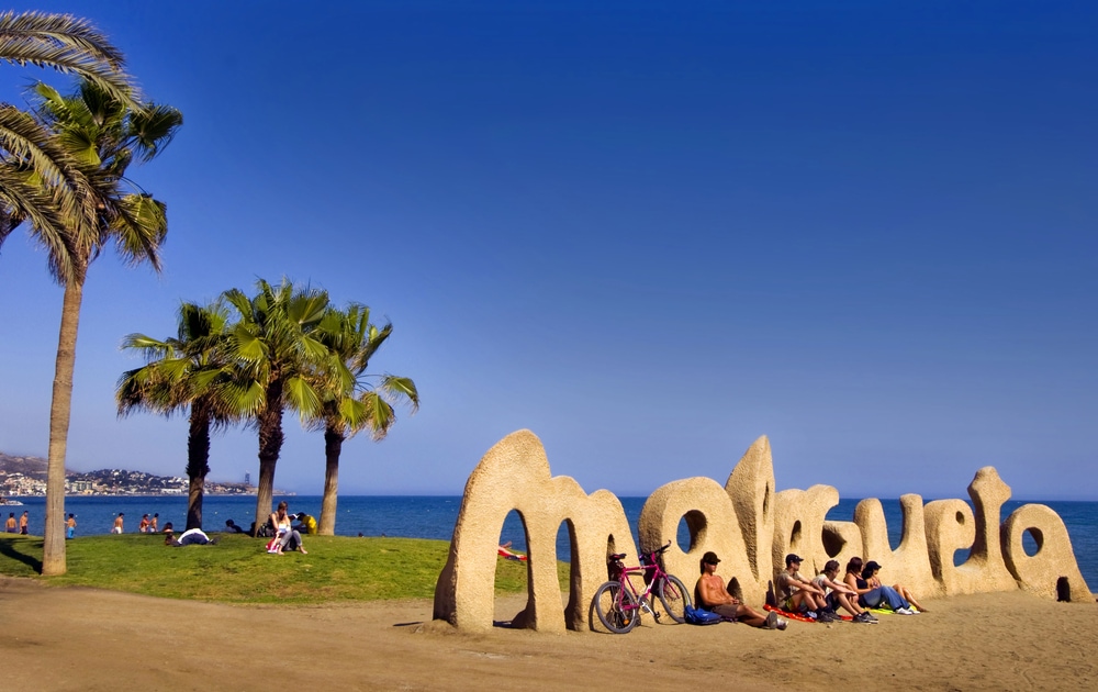 Malagueta Beach entrance sign welcomes visitors 