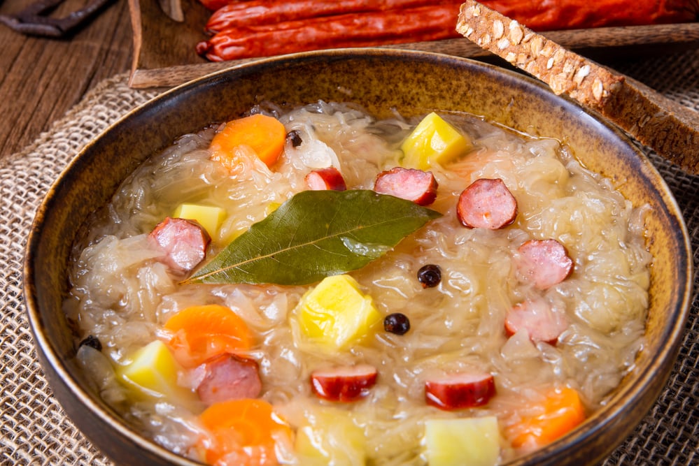 rustic sauerkraut soup with bacon and sausage