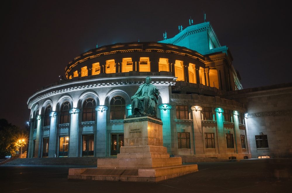National Academic Theatre of Opera and Ballet named after Alexander Spendiaryan of Armenia illuminated at night. Composer Spendiaryan statue.
