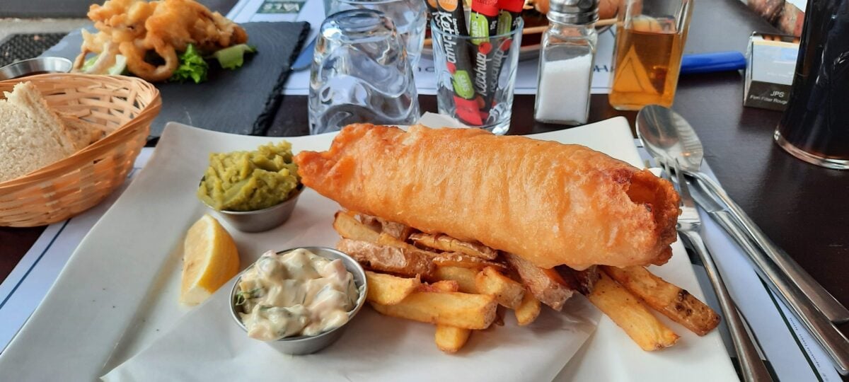 Fish and chips served with mushy peas