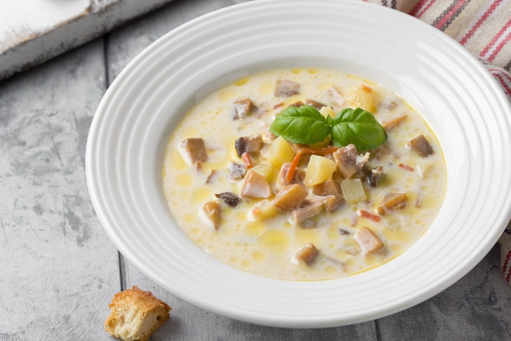 soup with mushrooms, potatoes, carrots and croutons Delicious cozy first course, tasty autumn food