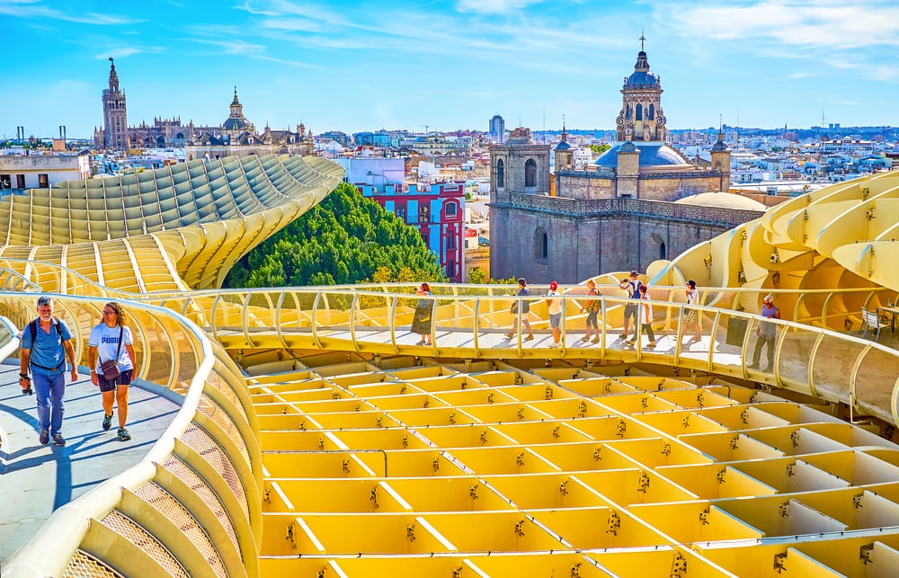 SEVILLE, SPAIN - OCTOBER 1, 2019: Lifting on the roof of Metropol Parasol has a fine opportunity to walk along footbridge with great viewpoints on historical neighborhood, on October 1 in Seville