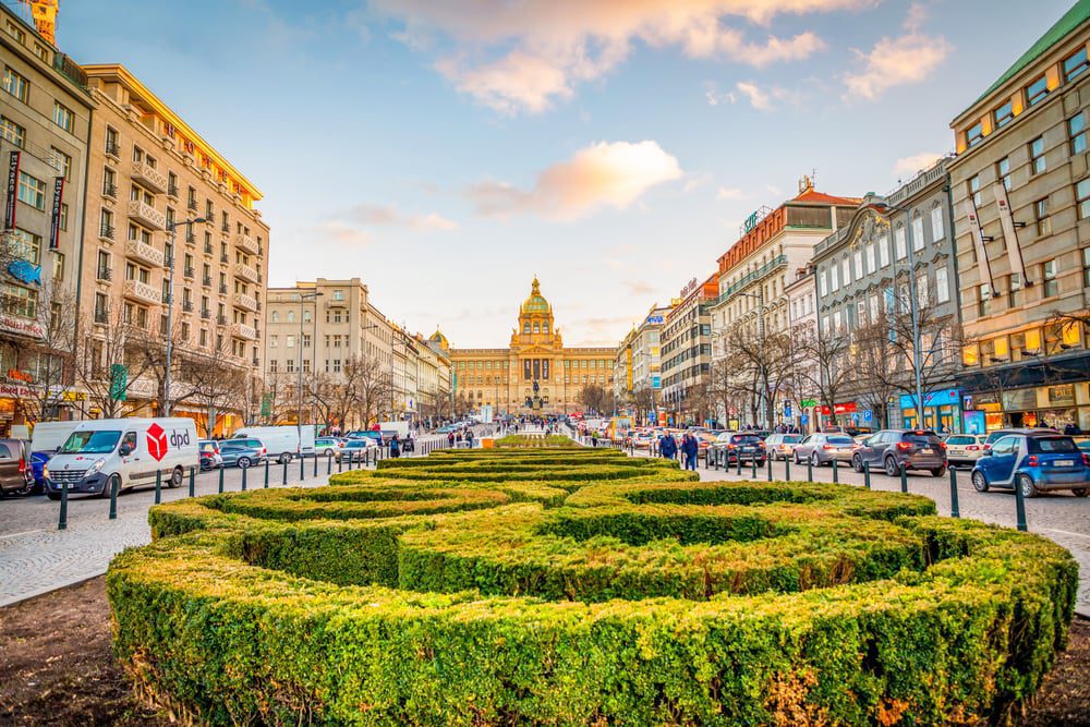 People on Wenceslas Square at sunset lights in Prague in Czech Republic.