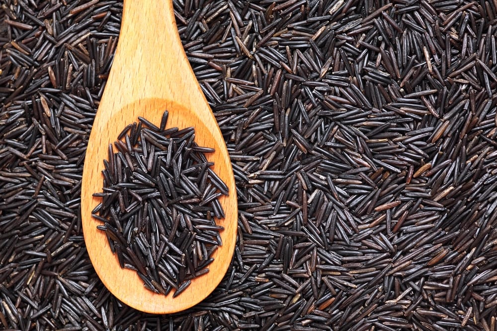 Wild rice in a wooden spoon