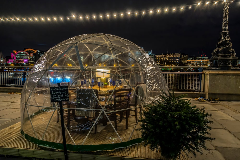 Nice transparent igloo on the banks of the Thames River where a festive dinner can be served.