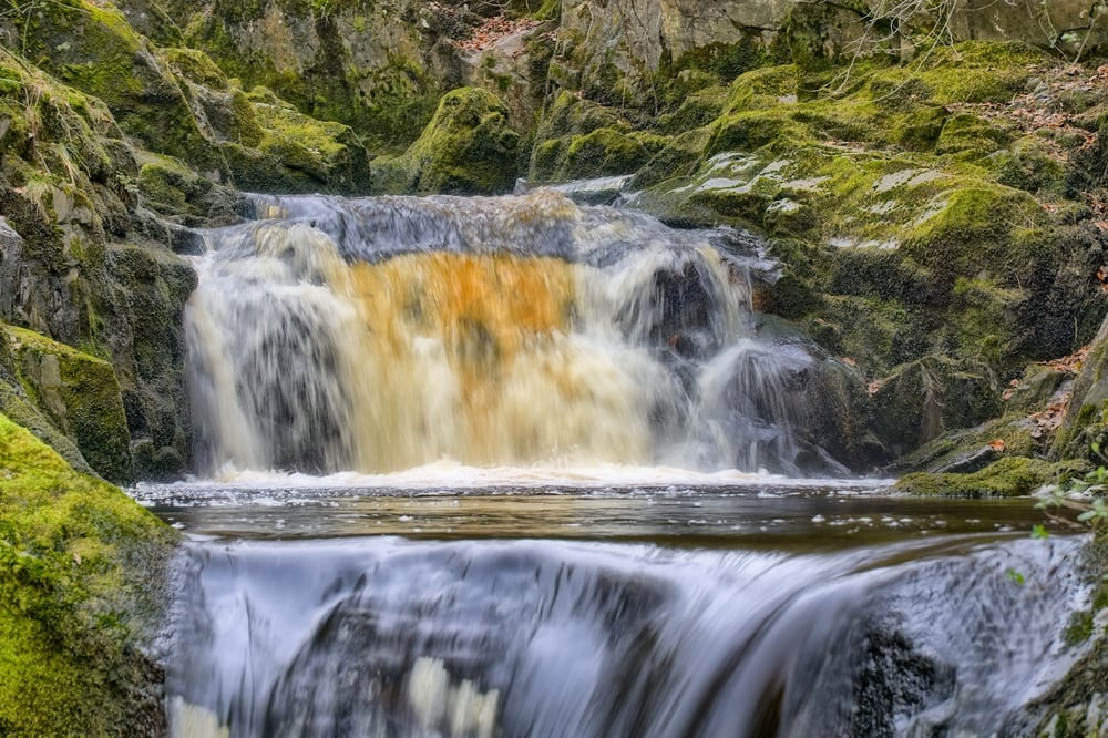 A close view of Pecca Falls, a waterfall near Ingleton in the Yorkshire Dales, Northern England.