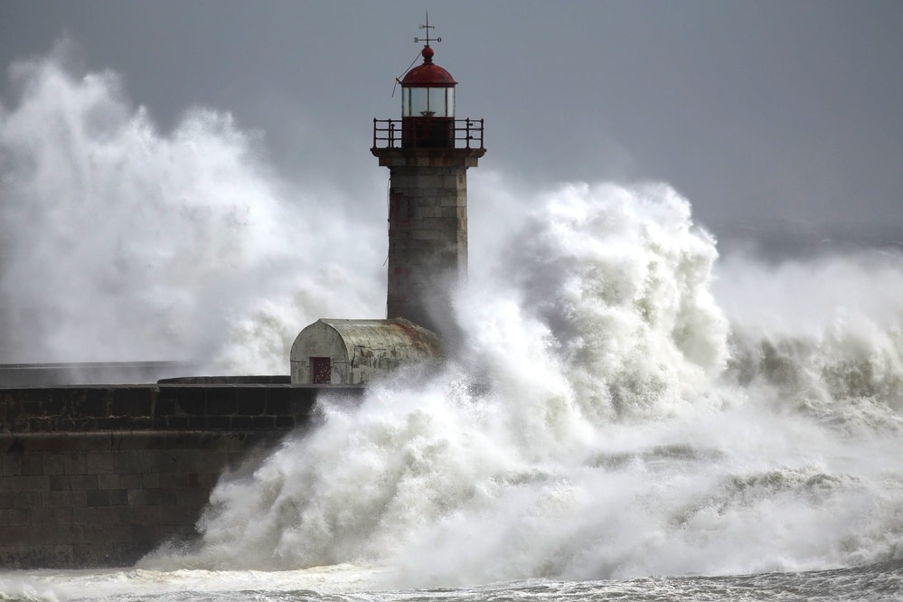 Stormy sea at the old lighthouse Porto Portugal