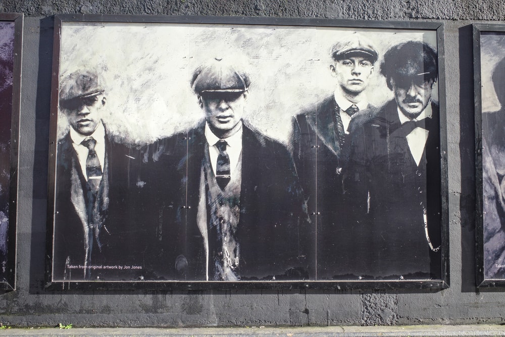 A group of men wearing suits and hats in Birmingham.