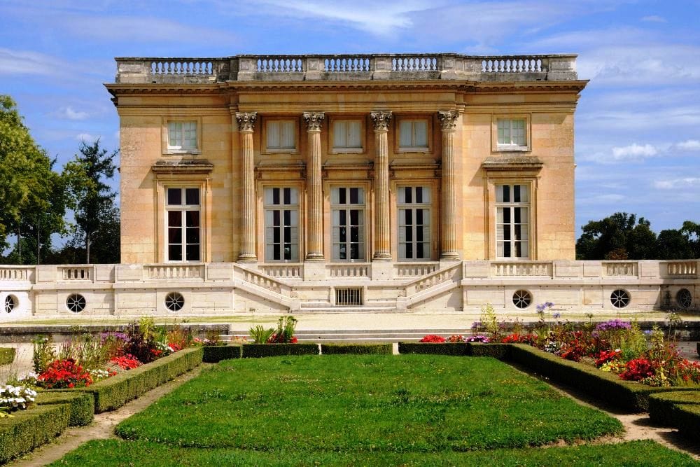 Petiti Trianon built for the Kings passion for botany and for his lover the Countess DuBarry.The building is built with a Neoclassical style and has a very grand interior and exterior. Its gardens next to it are also very picturesque 