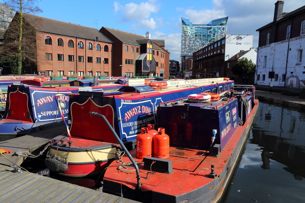 Narrowboats moored at Gas Street Basin in Birmingham, UK. Birmingham is the 2nd most populous British city. It has rich waterway and boat culture.