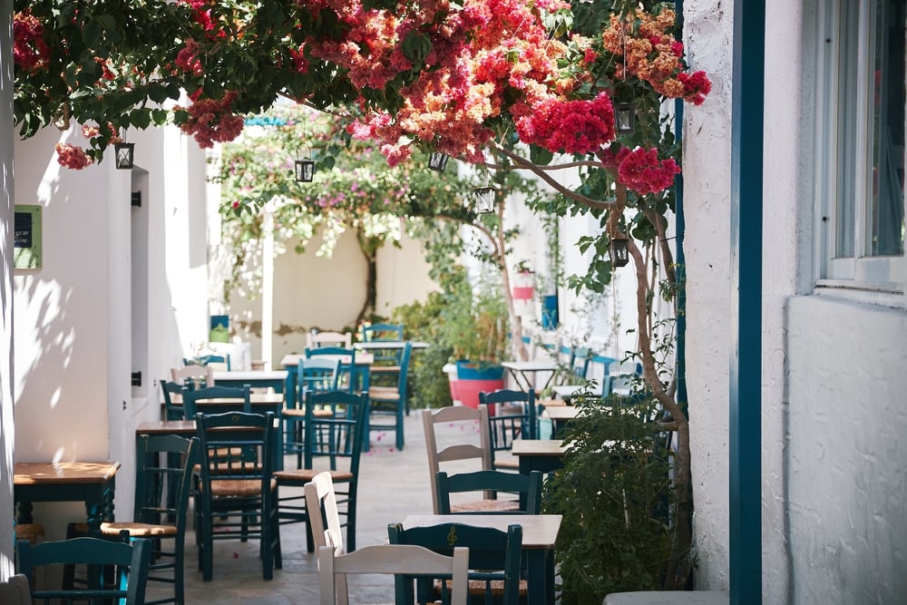 A beautiful shot of an outdoor cafe in the narrow bystreet in Paros, Greece