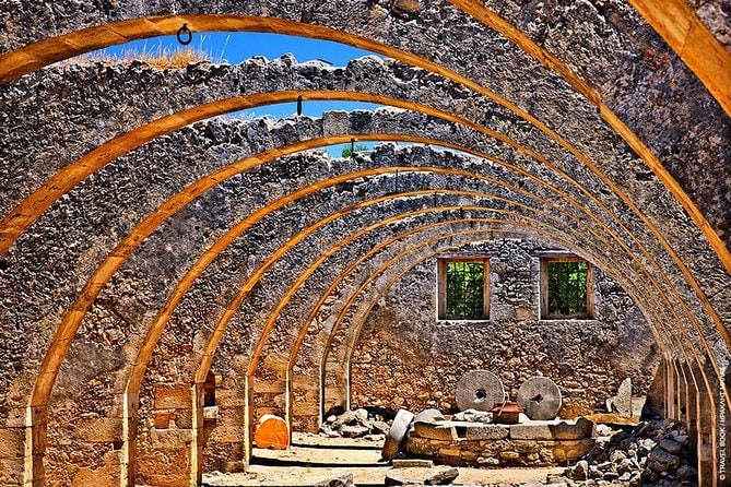 Discover the ancient arches of a stone building in Chania, Crete, Greece.