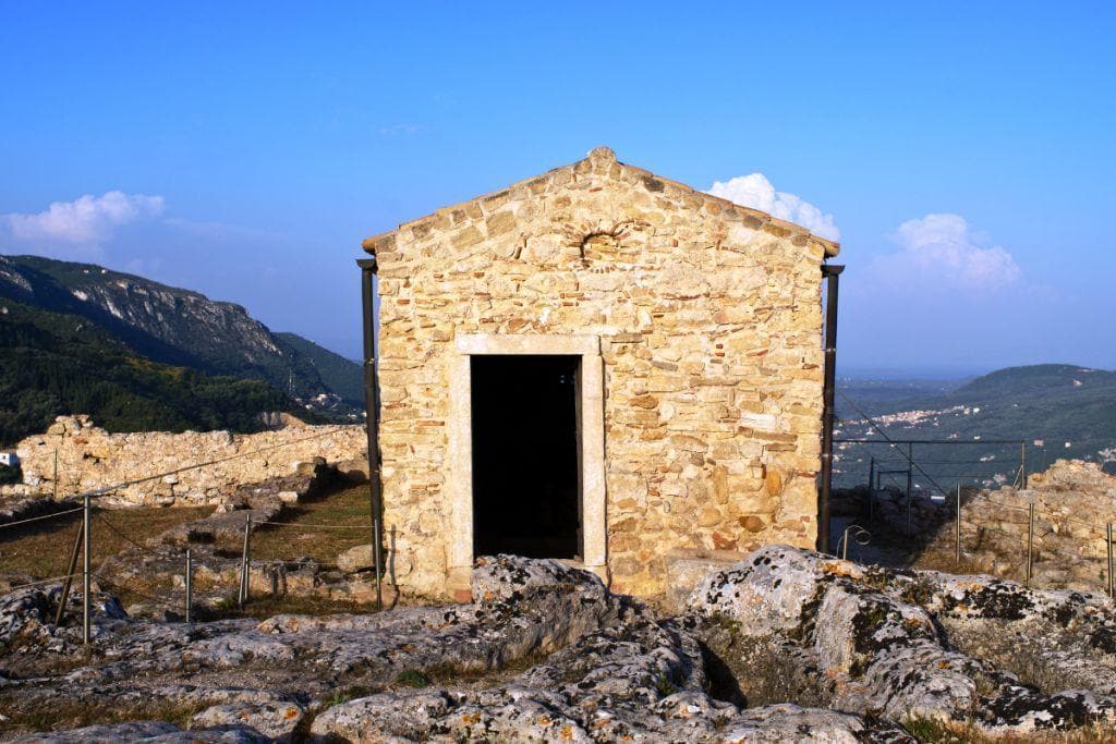 One of the best things to do in Corfu is visit a small stone building on top of a mountain.