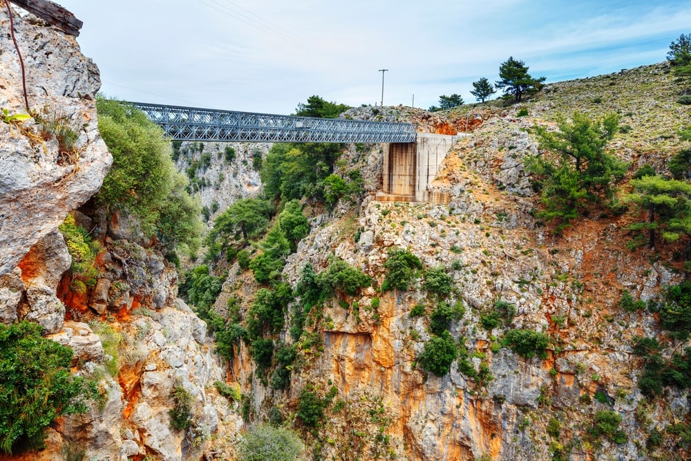 A breathtaking bridge over a cliff in Greece, offering one of the most exhilarating things to do in Chania. Famous truss bridge over Aradena Gorge, Crete Island, Greece