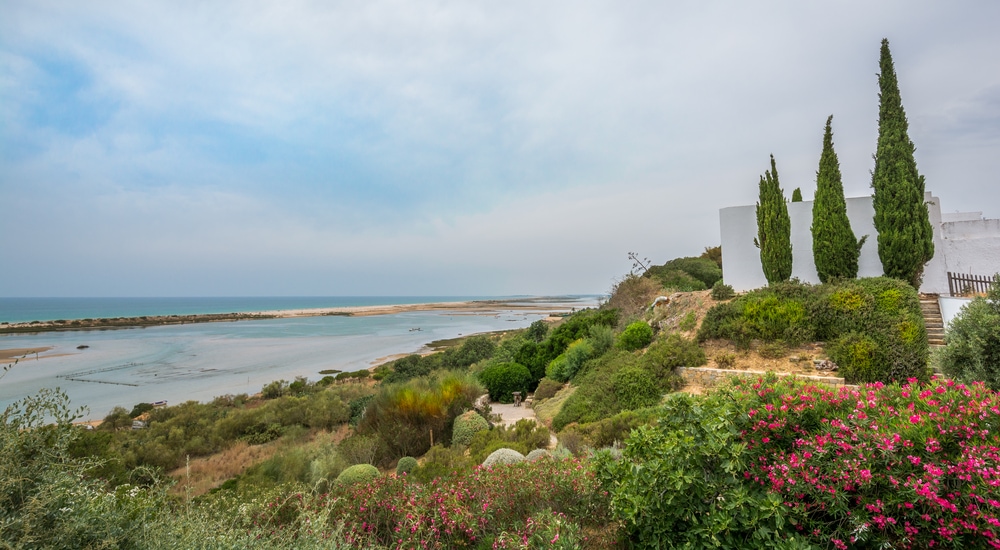 A white house on a hill overlooking one of the best beaches in Portugal.