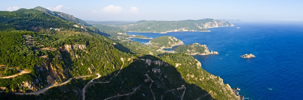 Enjoy the breathtaking view of a cliff and ocean from above in Corfu, one of the best things to do on the island.