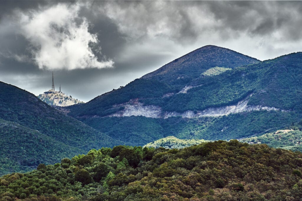 Explore the mountain range under a cloudy sky in Corfu.
