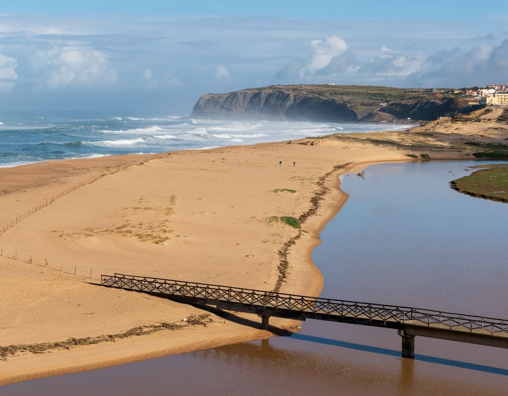 A bridge over a body of water near some of the best beaches in Portugal.