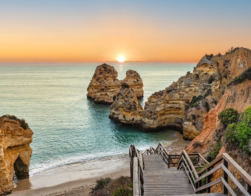 The stairs leading to one of the best beaches in Portugal at sunset in Algarve.