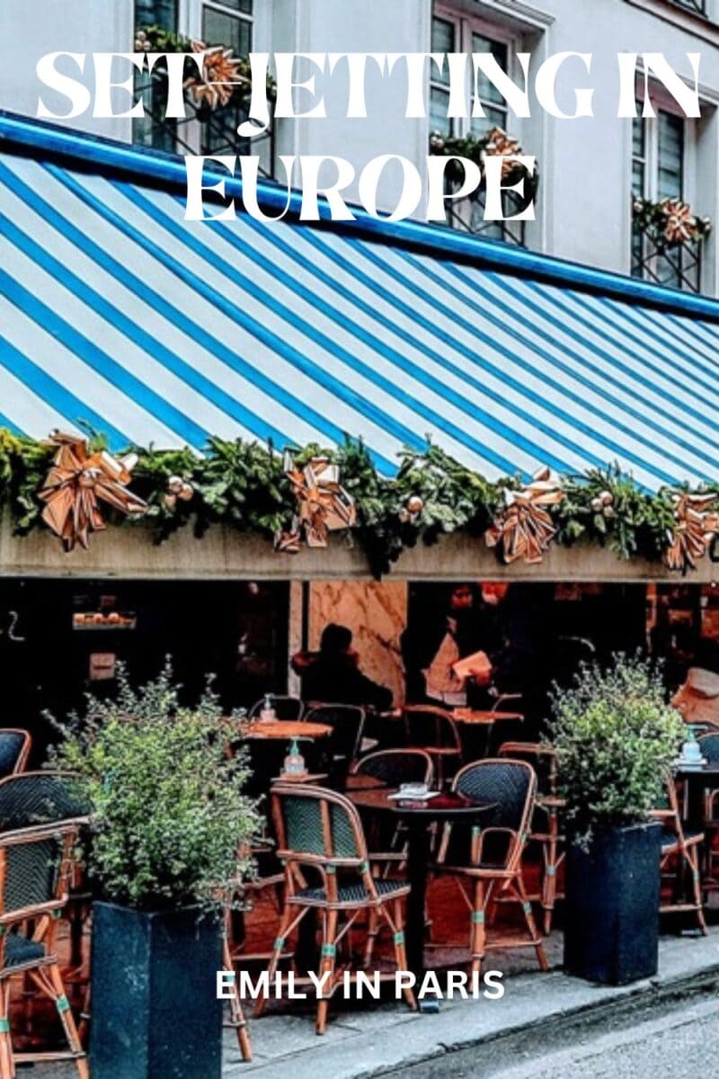 Chic sidewalk café with blue and white striped awning, a typical set-jetting destination in Europe.