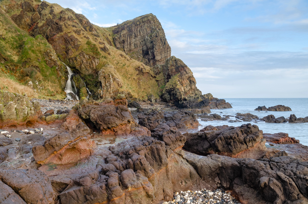 The Gobbins cliff Walk against rugged cliffs and the ocean