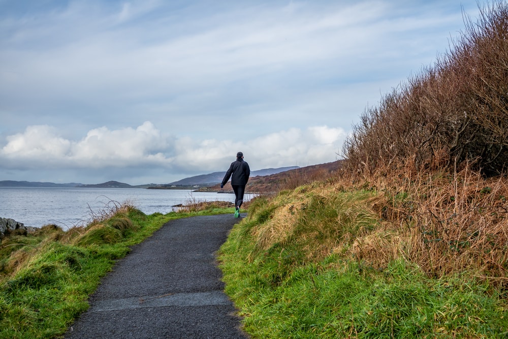 Lough Swilly Coastal path between Buncrana in County Donegal and the life boat Station. a pathway leads around the Lough with a runner on the trails