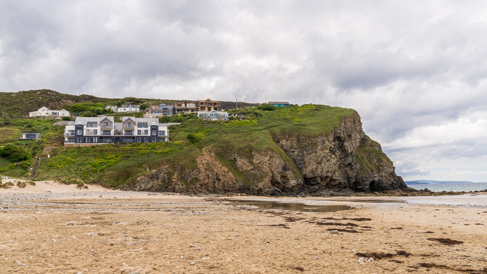 Porthtowan, Cornwall, England, UK - June 06, 2022: Houses on the cliffs of Porthtowan Beach
