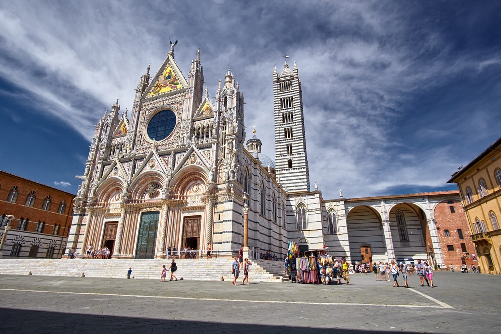 Historical city of Sienna  Italy and Cathedral. A splendid cathedral in the middle of a square, ranking among the best places to visit in Italy.