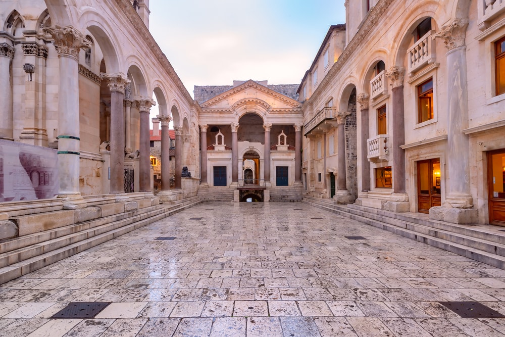 Peristyle, central square within Diocletian Palace in Old Town of Split, the second largest city of Croatia in the morning. Empty square within historical European architecture at twilight, offering things to do in Split, Croatia.