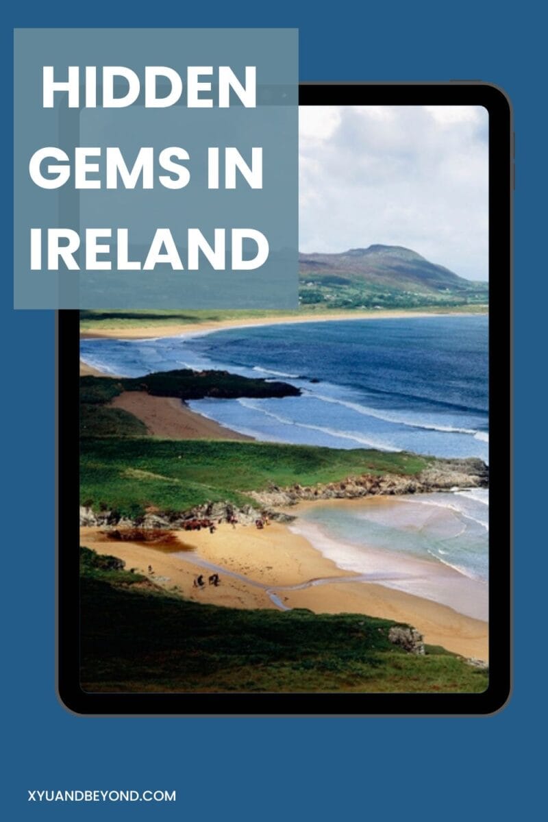 A tablet displaying an article titled 'hidden gems in Ireland' with a scenic coastal view in the background.