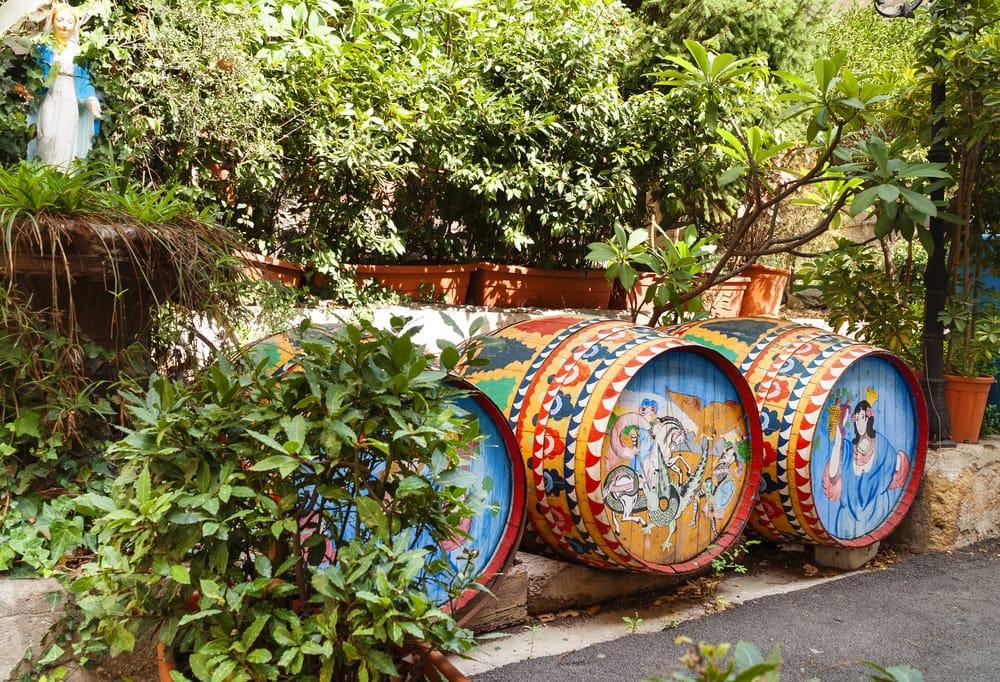 Beautifully painted in bright vivid colours traditional wine barrels at street of Palermo,Sicily