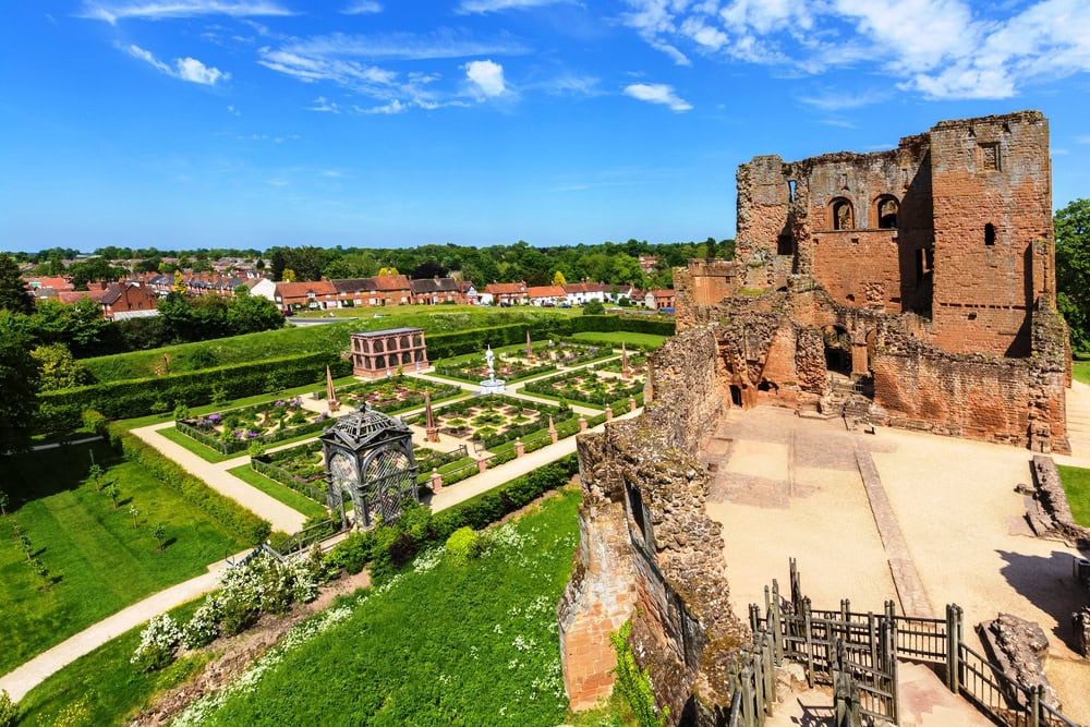 A view of Kenilworth Castle and the Elizabethan gardens from the steps of the ancient ruin