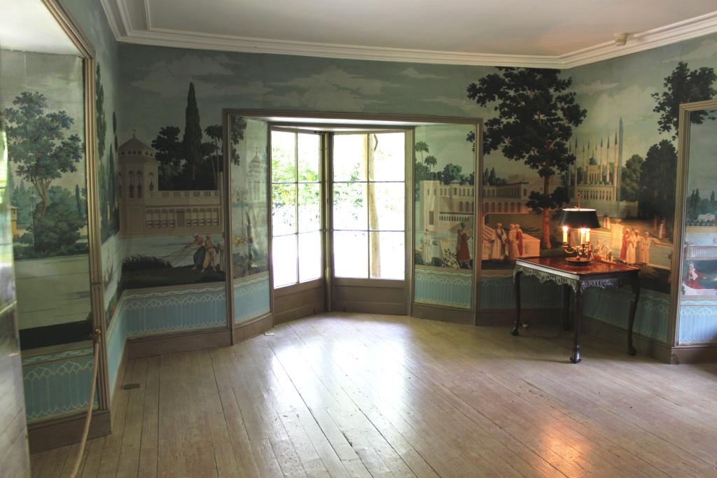 Highly decorative lounge at Swiss Cottage with the replica french wall paper that looks like a mural