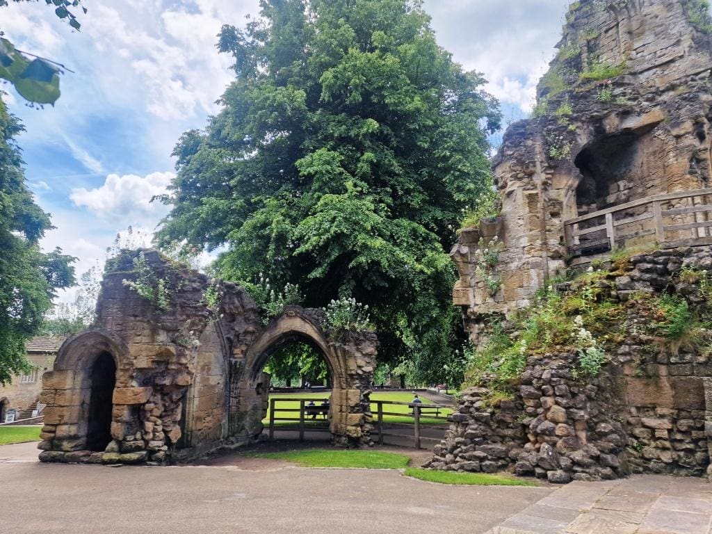 Explore the ruins of this medieval castle and enjoy stunning views of the River Nidd. There is a paid parking lot just outside the twin towers of the castle and you enter through these towers and you can still see the grooves of the portcullis.