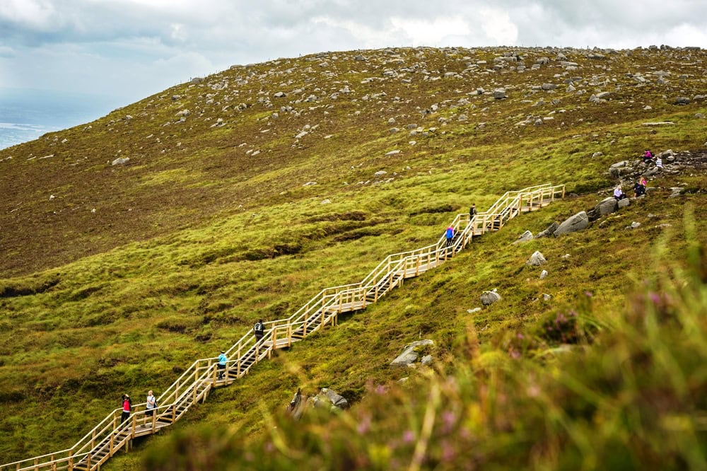 Walkers on The Stairway to Heaven at Cuilcagh mountain