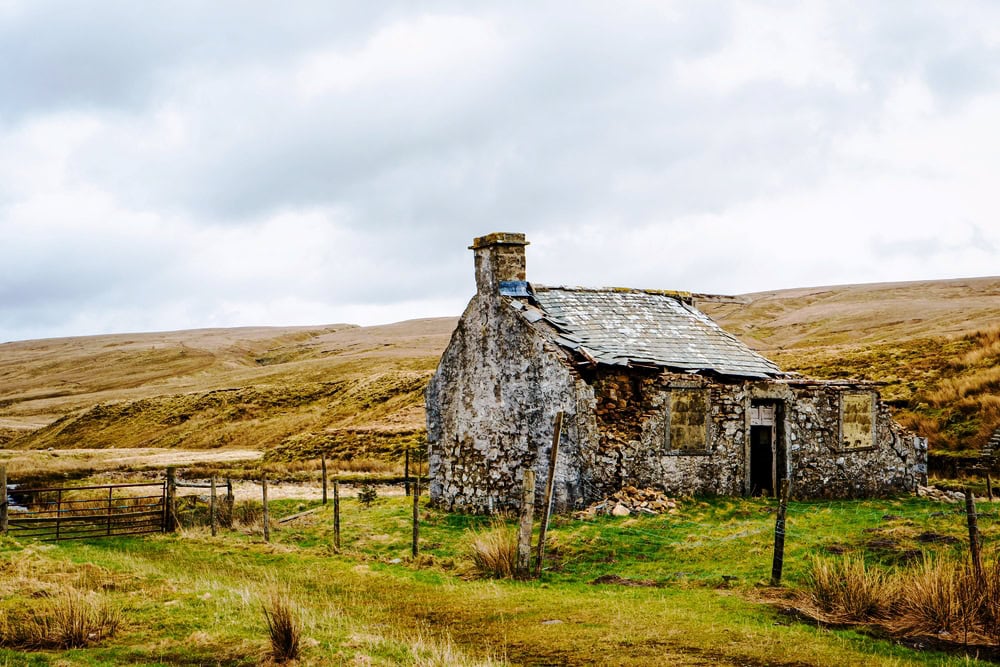 Derelict abandoned building, cottage, with crumbling walls in the Highlands of Scotland. Ulster Scots heritage
